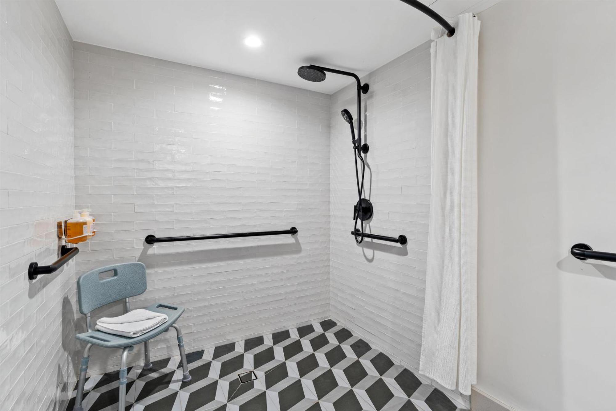 Room with One Full Bed and Roll-In Shower - Mobility Accessible
